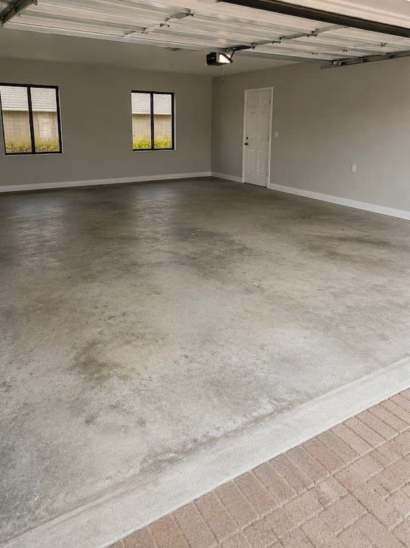 Dull, unfinished concrete garage floor before treatment